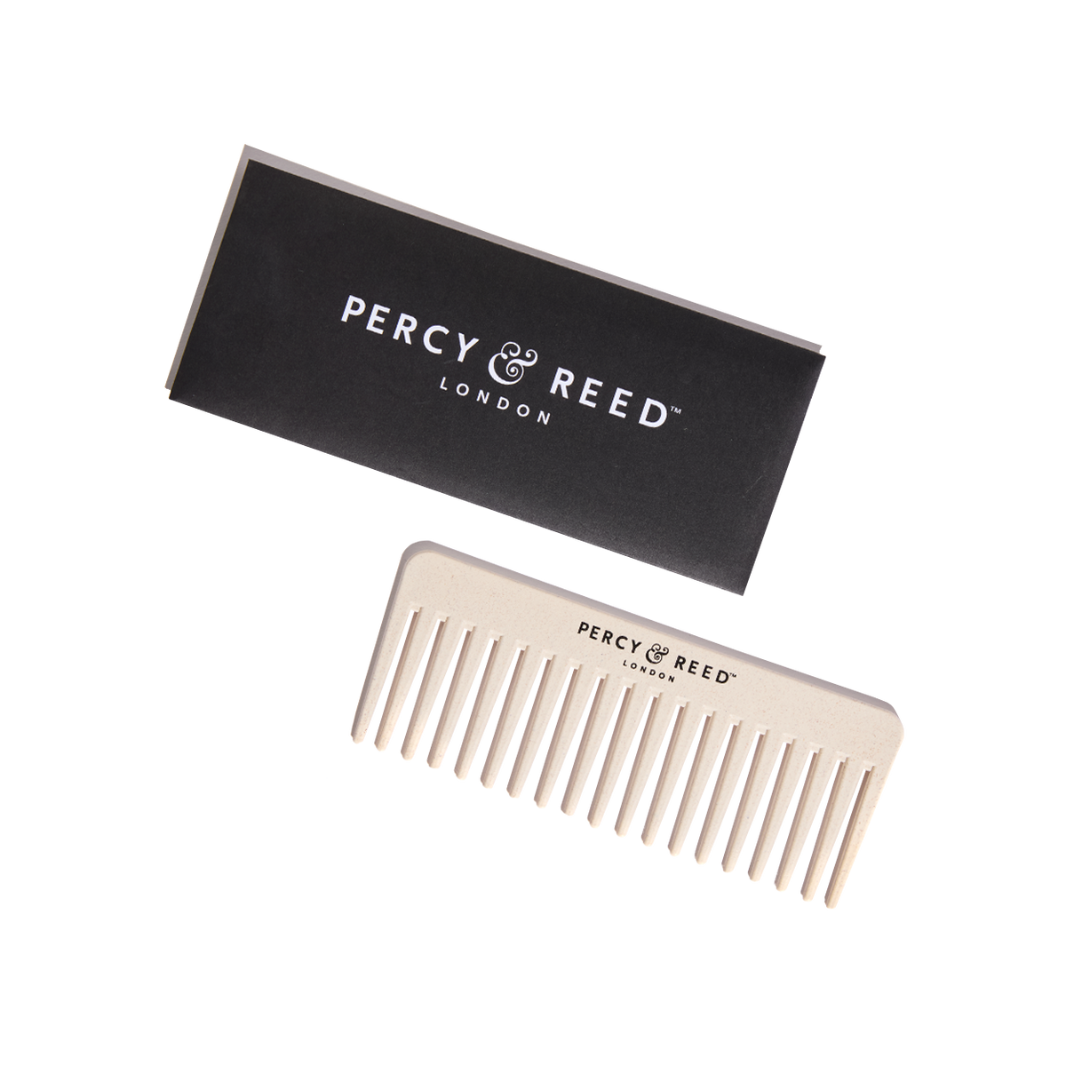 Percy & Reed cream-colored wide-tooth comb with black box packaging, featuring brand logo.