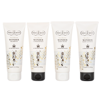 Four Percy & Reed Royal Blossom tubes: shampoo, conditioner, body wash, and lotion, in ornate packaging.